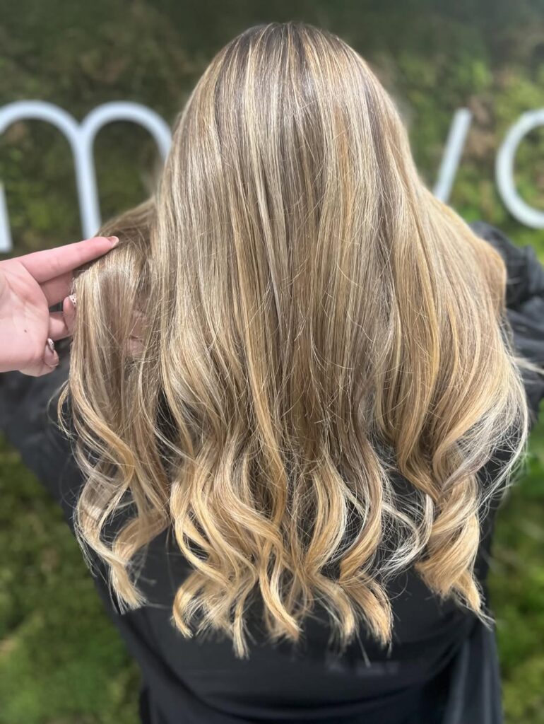 Warm balayage hair trend for winter at Mova Hair Salons in Virginia Water